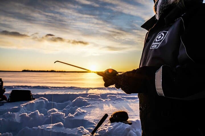 Ice Fishing on a Frozen Lake in Levi 5