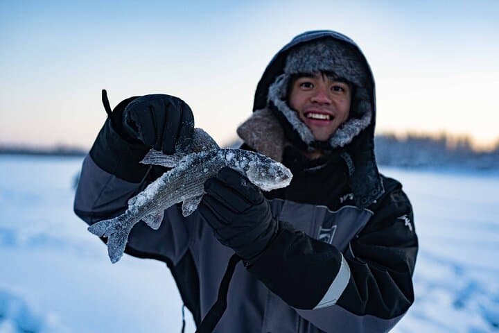 Ice fishing on a frozen lake 2