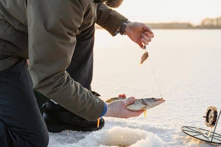 Ice Fishing Adventure in Lapland's Arctic Wilderness in Levi 3