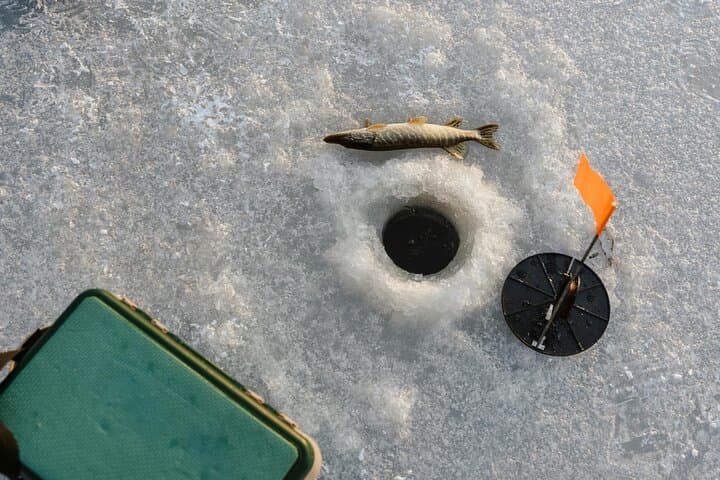 Ice Fishing Adventure in Lapland's Arctic Wilderness in Levi 5