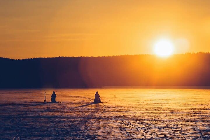 Ice Fishing Adventure in Lapland's Arctic Wilderness in Levi