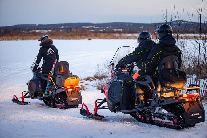 Ice fishing initiation by snowmobile in small group of 6 